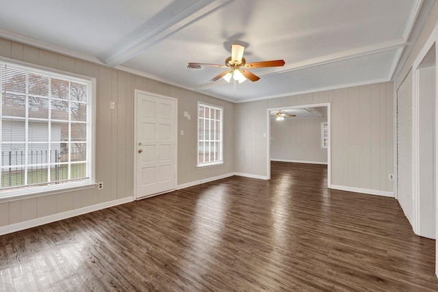 interior space with beam ceiling, ornamental molding, ceiling fan, and dark wood-type flooring