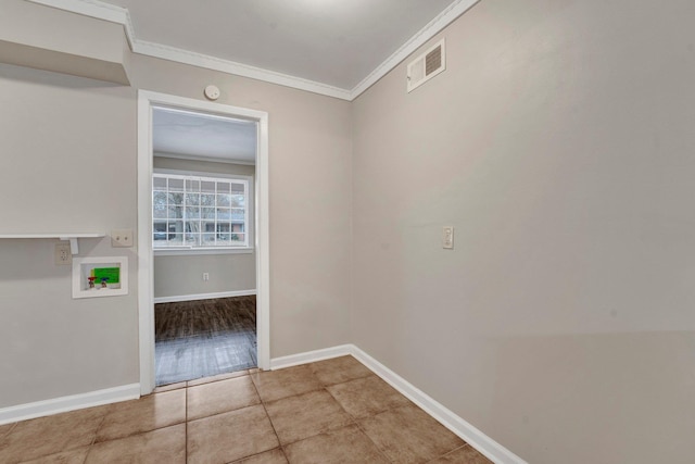 hall with light tile patterned flooring and ornamental molding