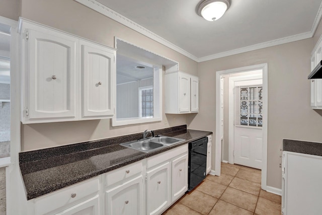 kitchen with white cabinets, sink, crown molding, and black dishwasher