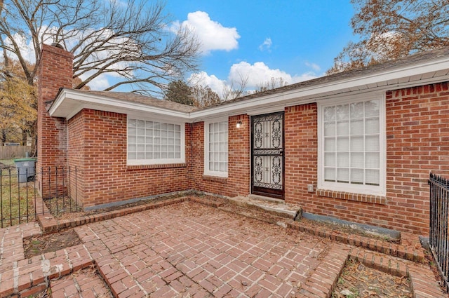 property entrance with a patio