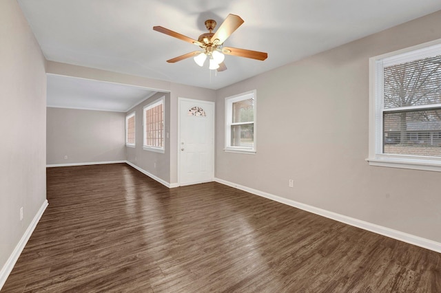 entrance foyer featuring ceiling fan and dark wood-type flooring