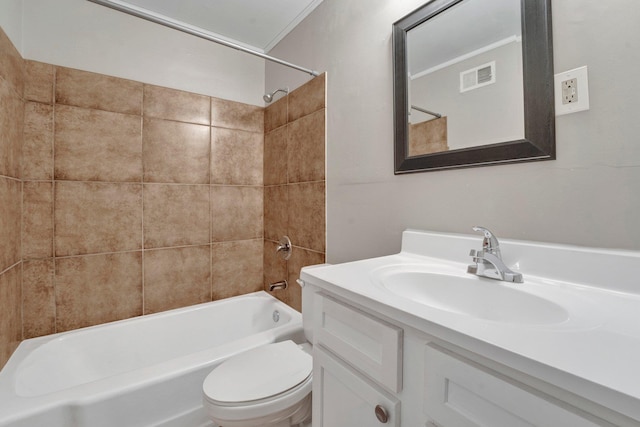 full bathroom with tiled shower / bath combo, toilet, ornamental molding, and vanity