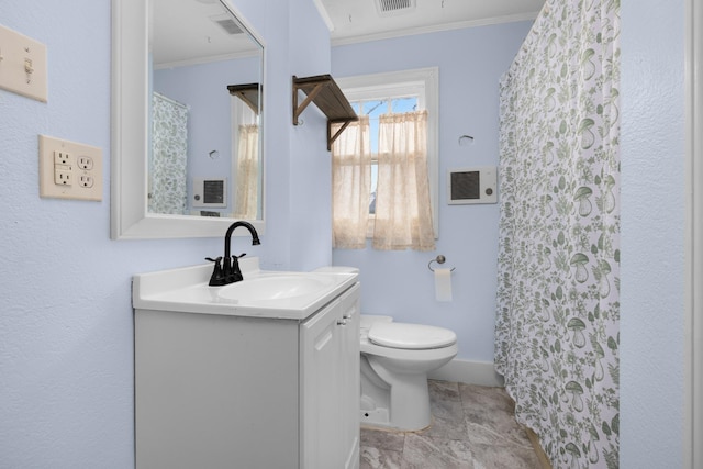 bathroom featuring vanity, toilet, and crown molding