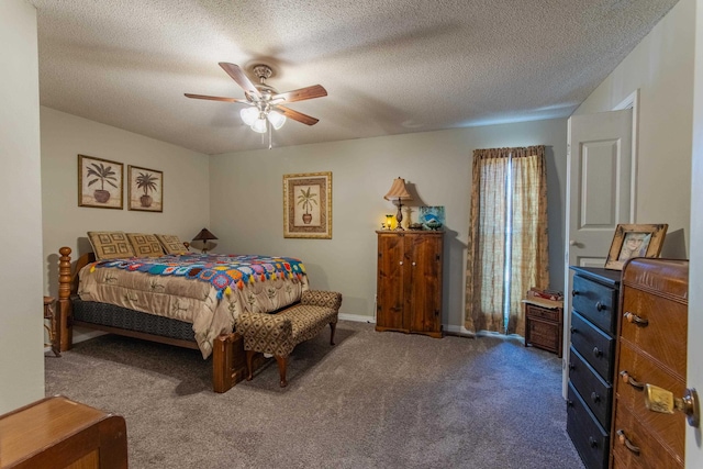 carpeted bedroom featuring ceiling fan and a textured ceiling