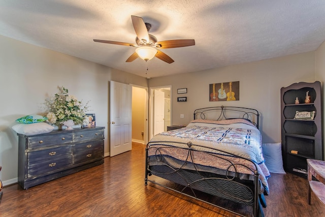 bedroom featuring a textured ceiling, dark hardwood / wood-style flooring, and ceiling fan