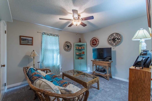 living room featuring carpet, a textured ceiling, and ceiling fan