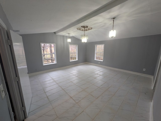 unfurnished room featuring vaulted ceiling