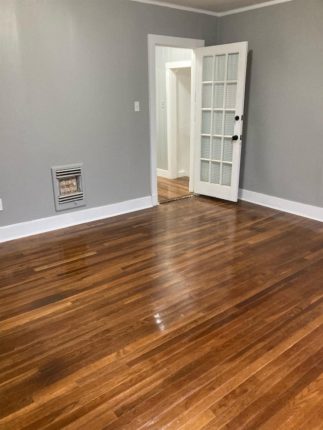 unfurnished room featuring dark hardwood / wood-style floors and ornamental molding