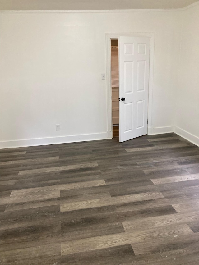 spare room with dark hardwood / wood-style flooring