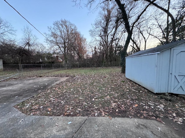 view of yard with a patio area and a shed