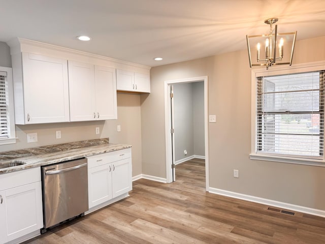 kitchen featuring white cabinetry, dishwasher, and pendant lighting