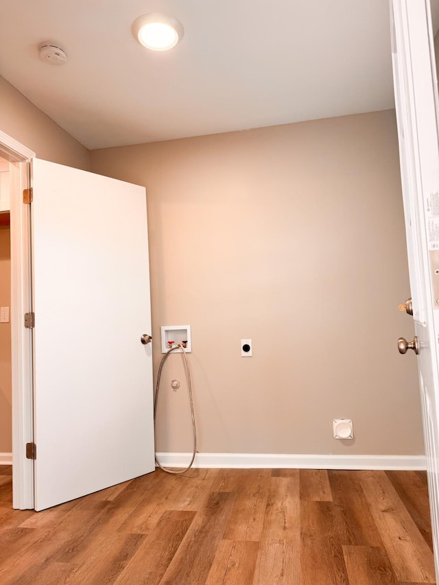 laundry room featuring hardwood / wood-style flooring, hookup for an electric dryer, and hookup for a washing machine