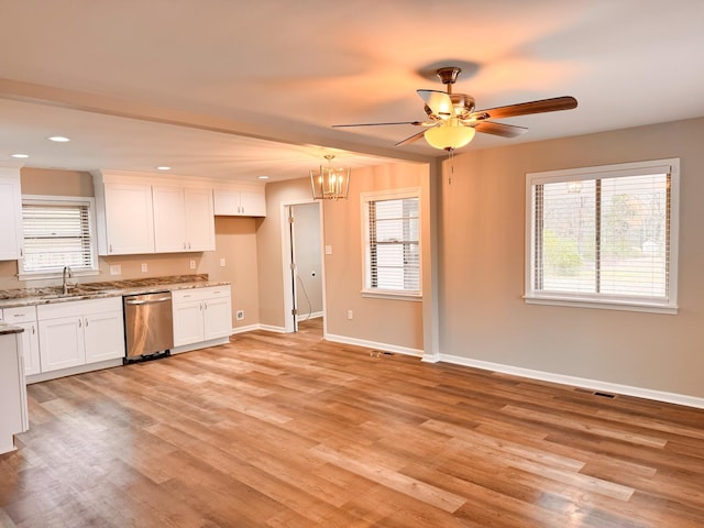 kitchen with white cabinets, dishwasher, and light wood-type flooring