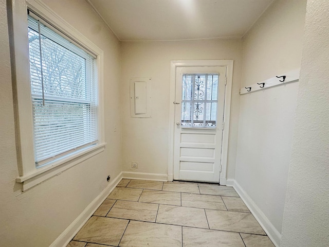 doorway to outside featuring electric panel