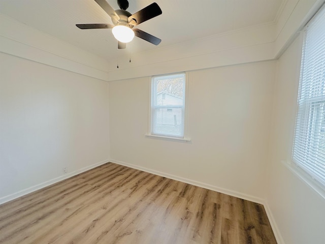 empty room with crown molding, ceiling fan, and light hardwood / wood-style floors