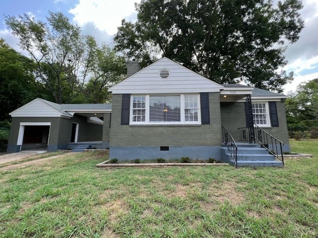 view of front of house featuring a garage and a front yard