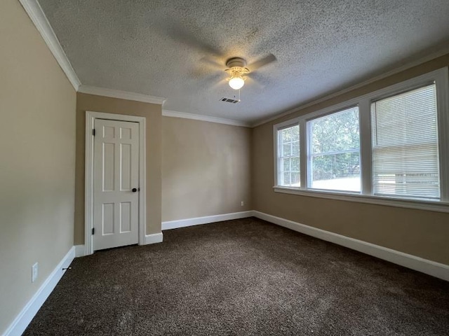 carpeted spare room with crown molding, ceiling fan, and a textured ceiling