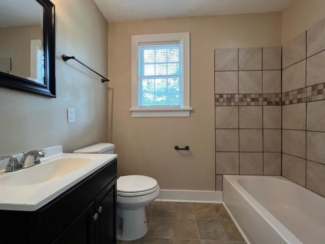 full bathroom featuring vanity, toilet, and tiled shower / bath combo