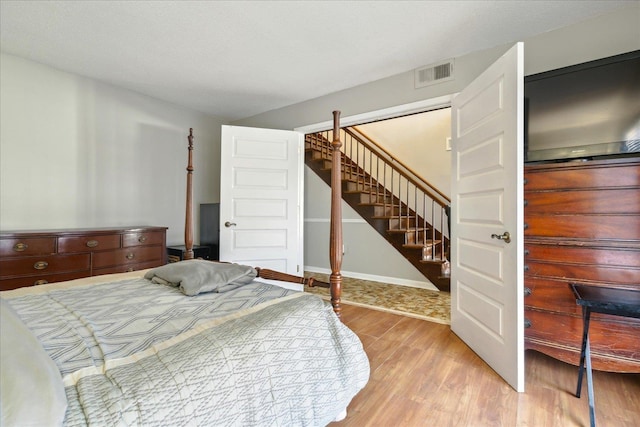 bedroom with light hardwood / wood-style flooring