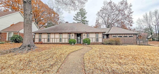 single story home with a front lawn