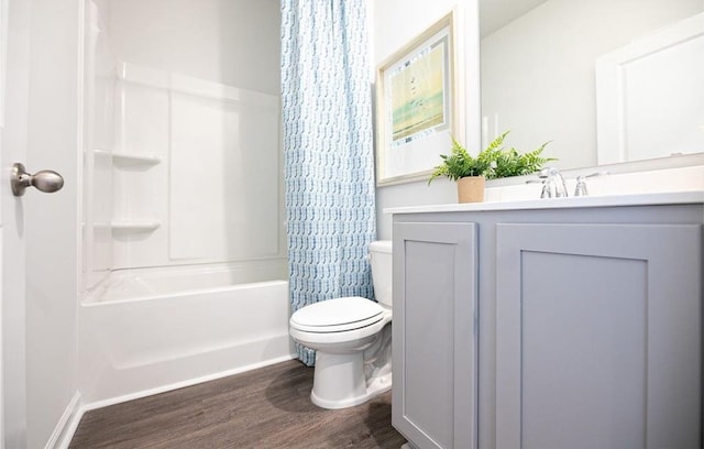 4489 Shelby Rd, Millington, TN 38053 - full bathroom featuring vanity, hardwood / wood-style flooring, toilet, and shower / bath combo with shower curtain