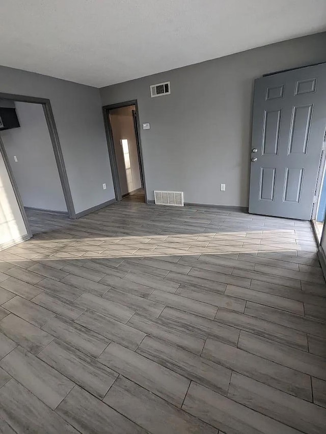 unfurnished living room with light wood-type flooring