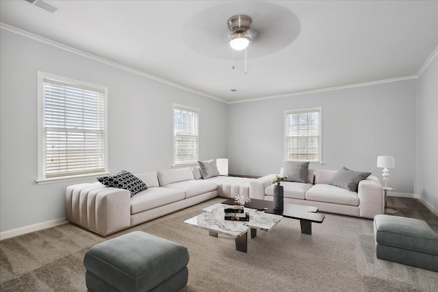 carpeted living room with crown molding and ceiling fan