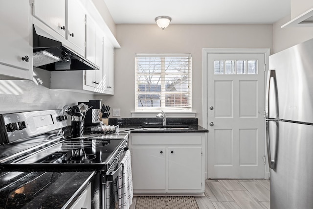 kitchen with sink, white cabinets, and appliances with stainless steel finishes