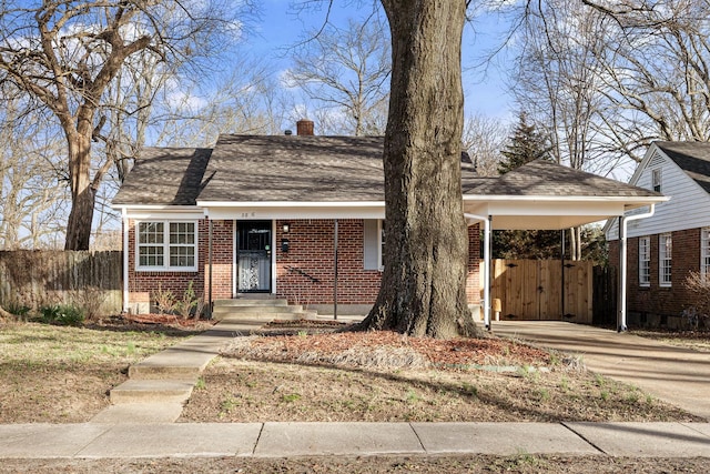 view of front of home with a carport