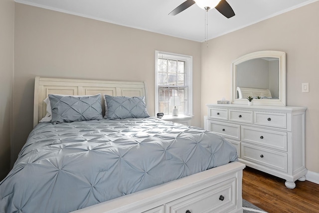 bedroom featuring ceiling fan, dark hardwood / wood-style flooring, and ornamental molding