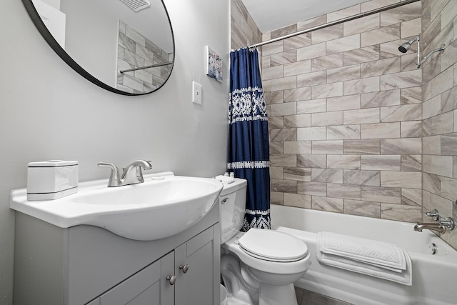 full bathroom with shower / bath combo with shower curtain, vanity, and toilet