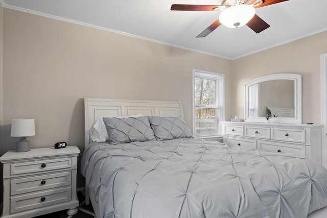 bedroom with ceiling fan and ornamental molding