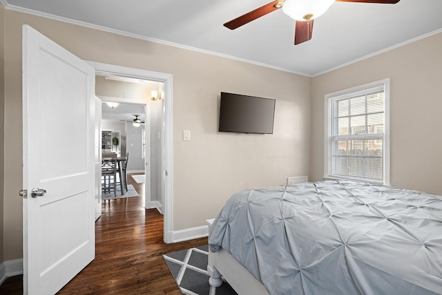 bedroom with ceiling fan, dark hardwood / wood-style floors, and ornamental molding