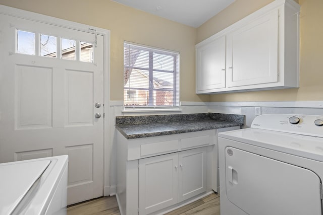 washroom with cabinets and light hardwood / wood-style flooring