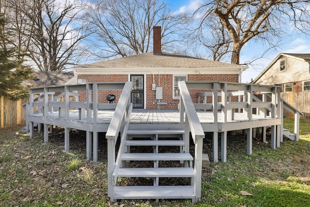 rear view of house featuring a deck