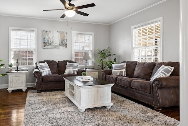 living room with a healthy amount of sunlight, dark hardwood / wood-style flooring, and crown molding