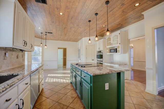 kitchen featuring a center island, white cabinetry, and green cabinets