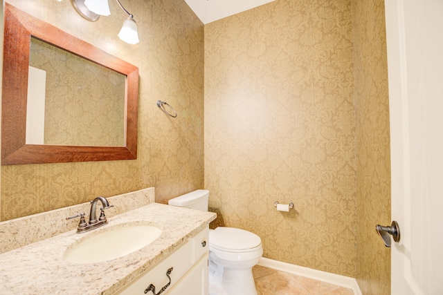 bathroom with tile patterned floors, vanity, and toilet