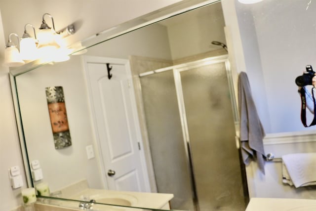 bathroom with vanity and walk in shower