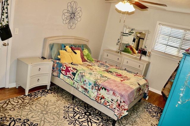 bedroom with ceiling fan, light hardwood / wood-style flooring, and lofted ceiling