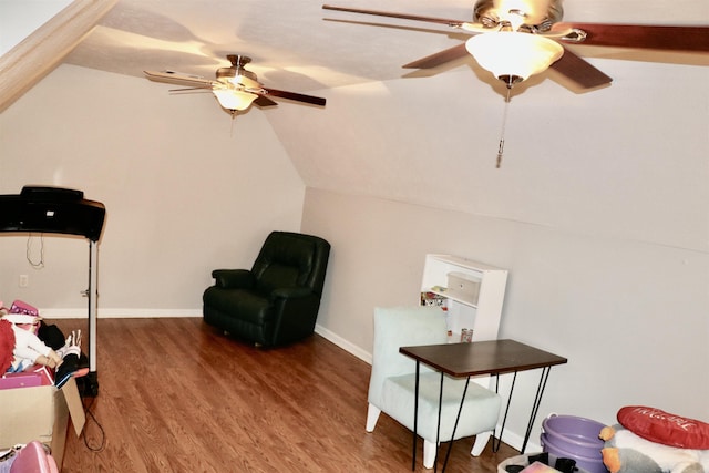 living area with lofted ceiling and wood-type flooring