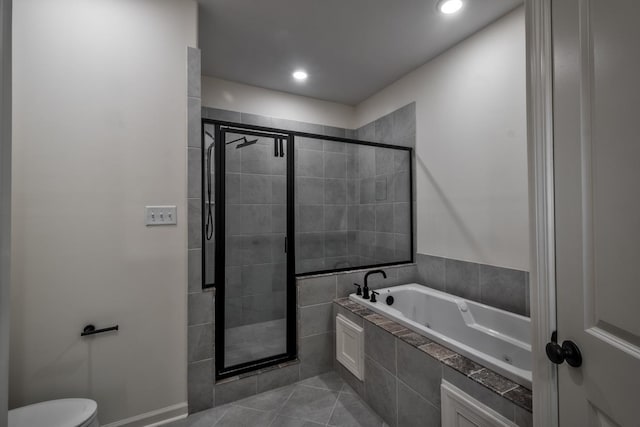 bathroom with tile patterned flooring, toilet, and plus walk in shower