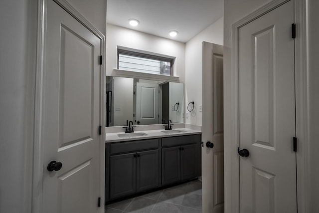 bathroom with tile patterned flooring and vanity