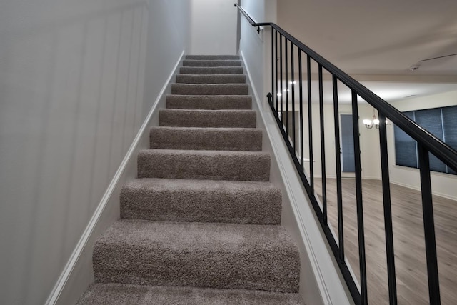 staircase featuring hardwood / wood-style floors