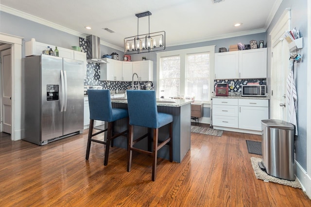 kitchen featuring white cabinetry, light stone countertops, dark wood-type flooring, a kitchen island with sink, and appliances with stainless steel finishes