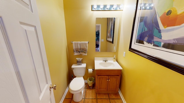 bathroom featuring tile patterned floors, vanity, and toilet