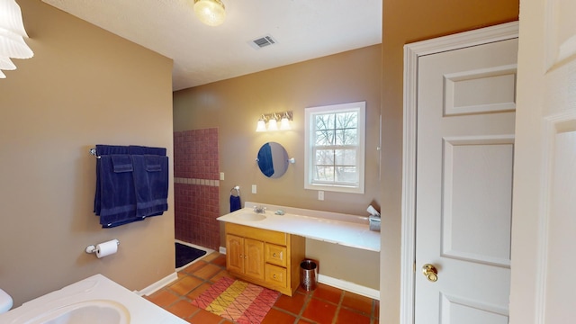 bathroom with vanity and tile patterned floors