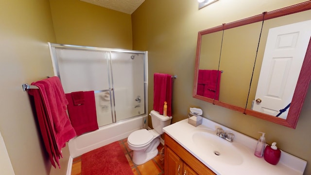 full bathroom featuring a textured ceiling, vanity, toilet, and bath / shower combo with glass door