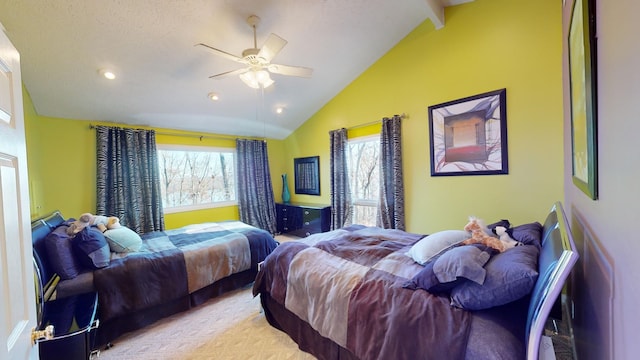 carpeted bedroom with ceiling fan and lofted ceiling with beams