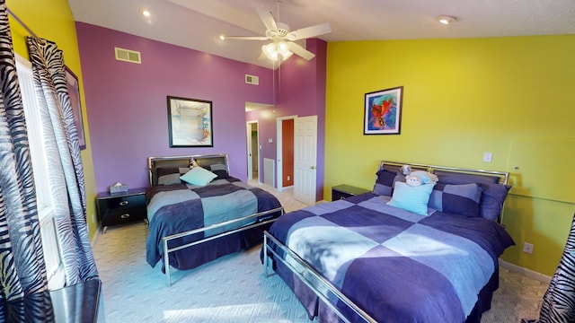 bedroom with ceiling fan, high vaulted ceiling, and light colored carpet